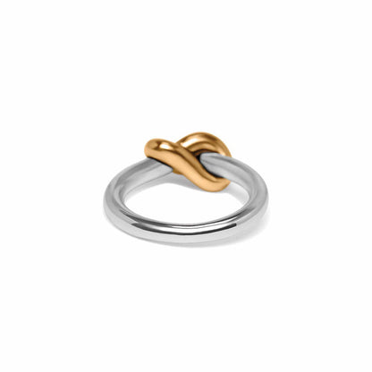 Brighton ring with silver-plated band and gold-plated knot accent at the center on a white background