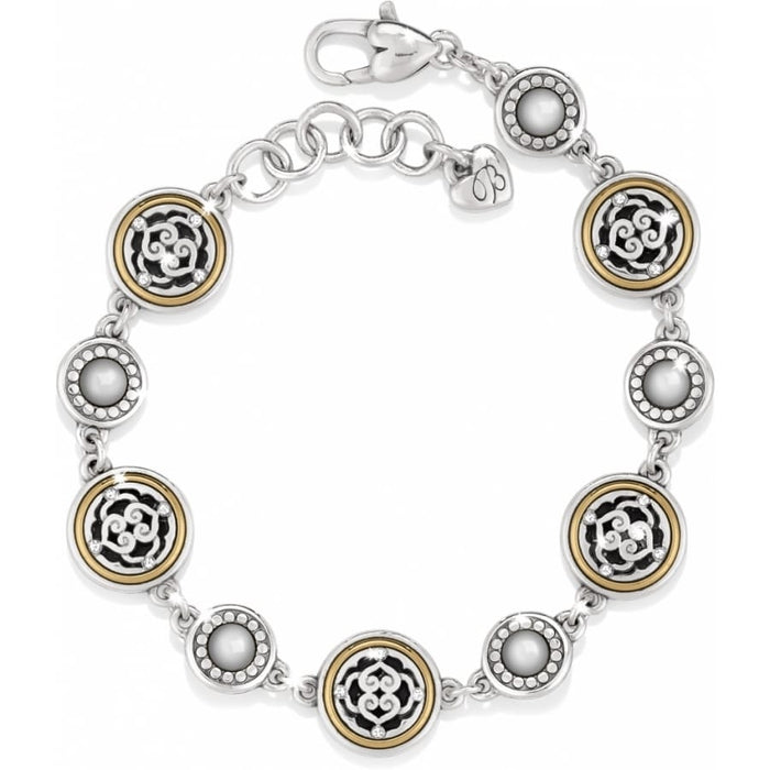 Brighton bracelet with silver-plated and gold-plated medallions featuring scrollwork and pearl-like cabochon accents on a white background