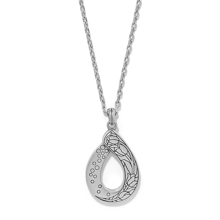 Brighton pendant necklace with silver-plated teardrop featuring engraved floral and dotted patterns on a white background