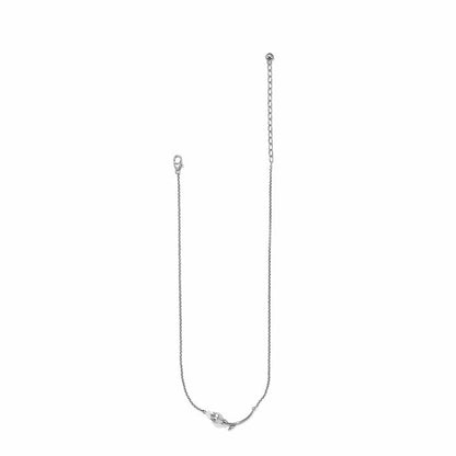 Brighton silver-plated necklace with delicate chain, floral accent, lobster clasp, and adjustable extender on a white background