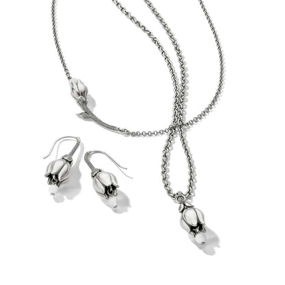 Brighton silver-plated necklace and drop earrings set with tulip-shaped pendants and white bead accents on a white background