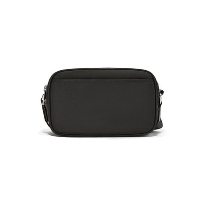 Brighton crossbody handbag shown from the back in black with silver-tone zipper hardware on a white background