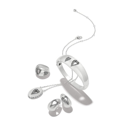 Brighton silver-plated jewelry set styled with heart-shaped crystal accents on bangle, ring, pendant necklace, and earrings