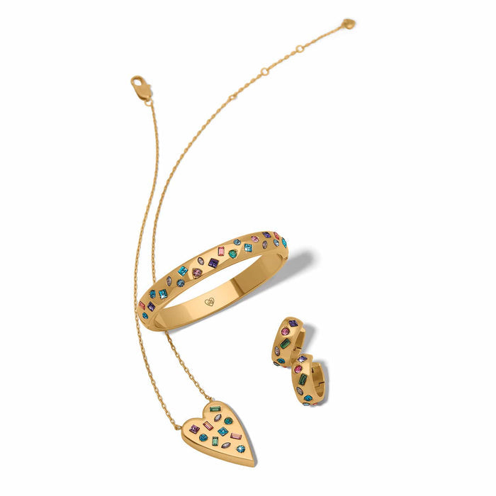 Brighton gold-plated jewelry styled with a heart pendant necklace, multicolor crystal bangle, and matching hoop earrings
