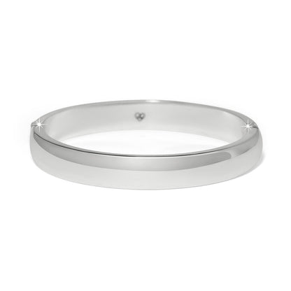 Brighton bangle bracelet with smooth polished silver-plated finish and small heart detail inside on a white background