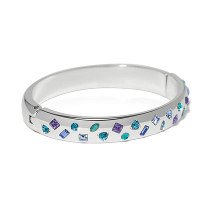 Brighton silver-plated bangle bracelet with scattered blue, teal, and purple crystals in mixed shapes on a white background