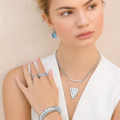 Model wearing a Brighton silver-plated heart pendant necklace with crystal accents and coordinating Brighton accessories