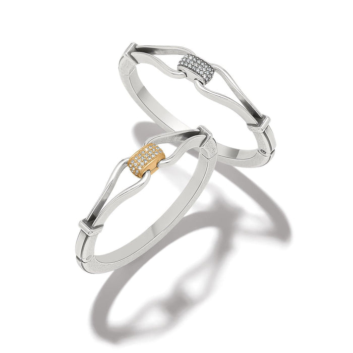 Brighton silver-plated bangle bracelets with crystal pavé centerpieces in silver and gold-plated finishes on a white background