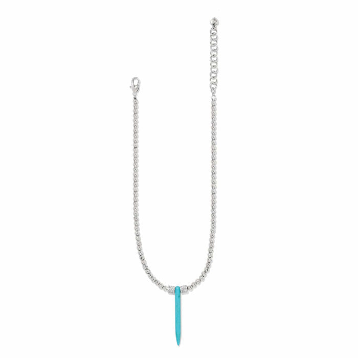 Brighton pendant necklace with silver-plated beaded chain and blue howlite turquoise spike pendant on a white background