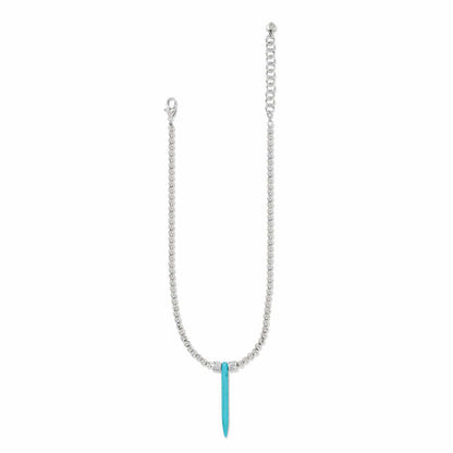 Brighton pendant necklace with silver-plated beaded chain and blue howlite turquoise spike pendant on a white background