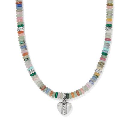 Brighton beaded necklace with multicolor gemstones, silver-plated scroll accents, and heart pendant on a white background