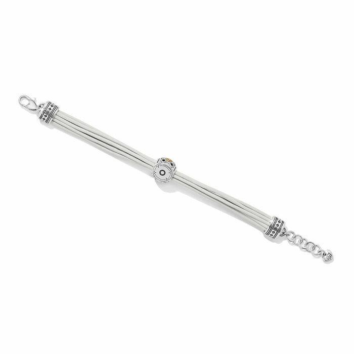 Brighton bracelet with white leather cords, two-tone decorative beads, lobster clasp, and extender chain on a white background