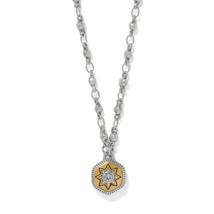 Brighton pendant necklace with two-tone star medallion, crystal center, and silver-tone chain on a white background