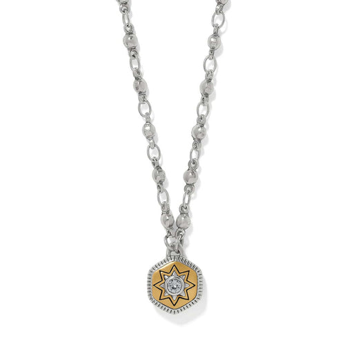 Brighton pendant necklace with two-tone star medallion, crystal center, and silver-tone chain on a white background