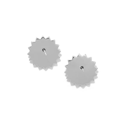 Brighton stud earrings shown from the back with silver-tone sunburst-shaped settings and posts on a white background