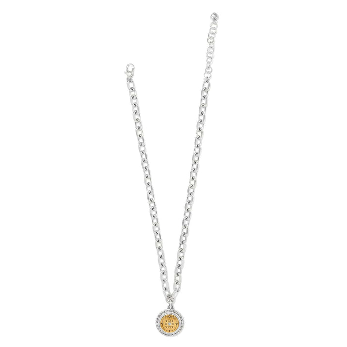 Brighton pendant necklace with two-tone round medallion, crystal center, and silver-tone chain on a white background