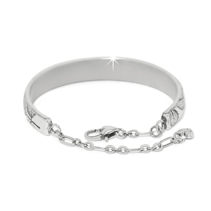 Brighton bangle bracelet with silver-plated finish, engraved leaf detailing, lobster clasp, and chain accent on a white background