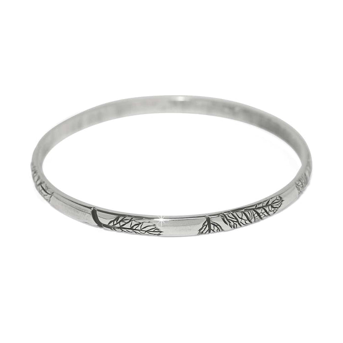 Brighton bangle bracelet with silver-plated finish and engraved leaf and branch detailing on a white background