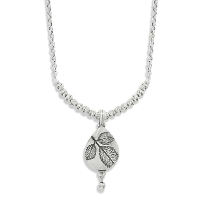 Brighton pendant necklace with silver-plated beaded chain and teardrop leaf-engraved pendant on a white background