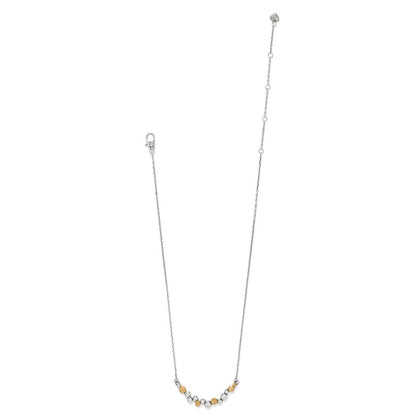 Brighton necklace with silver-tone chain, lobster clasp, and small two-tone beaded center accent on a white background