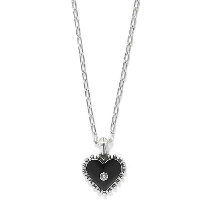 Brighton heart pendant necklace with black enamel, silver-plated beaded edge, and crystal center on a white background