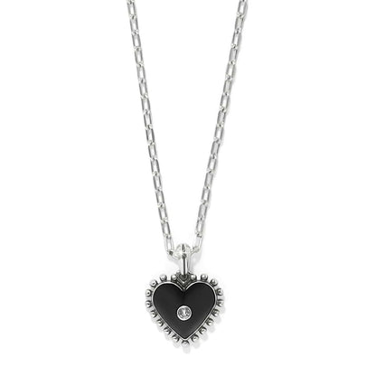 Brighton heart pendant necklace with black enamel, silver-plated beaded edge, and crystal center on a white background