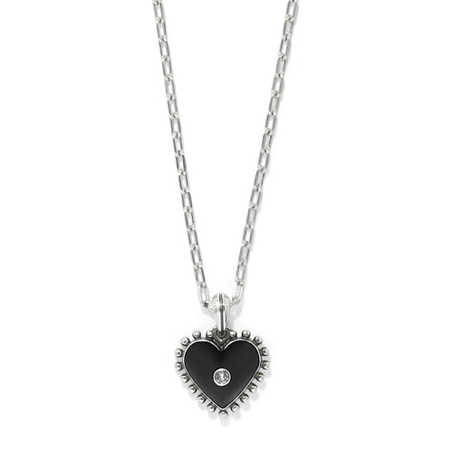 Brighton heart pendant necklace with black enamel, silver-plated beaded edge, and crystal center on a white background