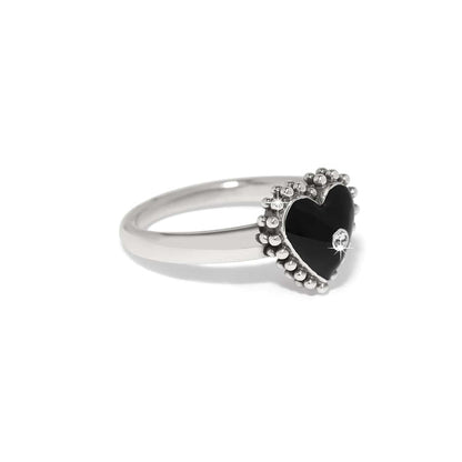 Brighton silver-plated ring with black enamel heart, crystal accent, and beaded border on a white background