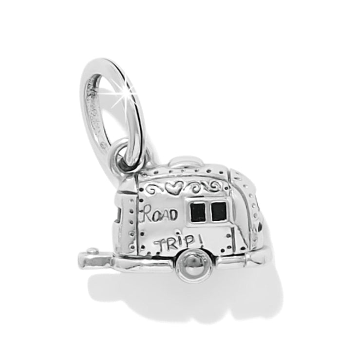 Brighton charm shaped like a silver-plated camper trailer with Road Trip engraving and enamel windows on a white background