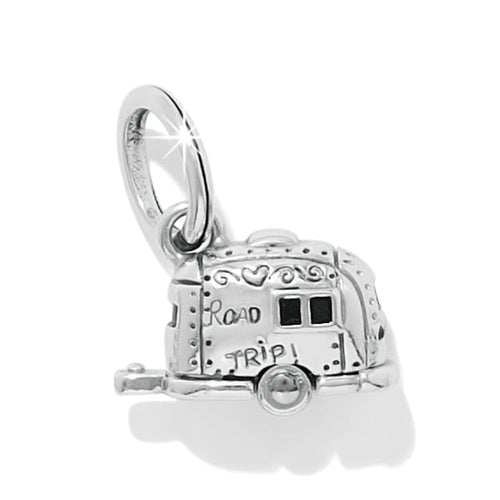 Brighton charm shaped like a silver-plated camper trailer with Road Trip engraving and enamel windows on a white background