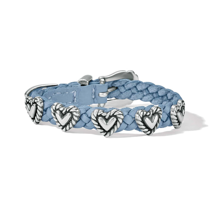 Brighton braided light blue leather bracelet with silver-plated heart stations and buckle closure on a white background