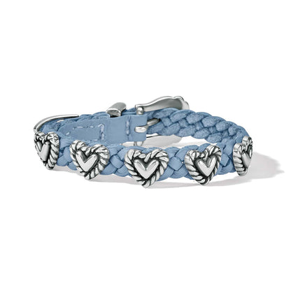 Brighton braided light blue leather bracelet with silver-plated heart stations and buckle closure on a white background