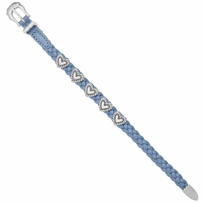 Brighton braided blue leather bracelet with silver-plated heart accents and buckle closure on a white background