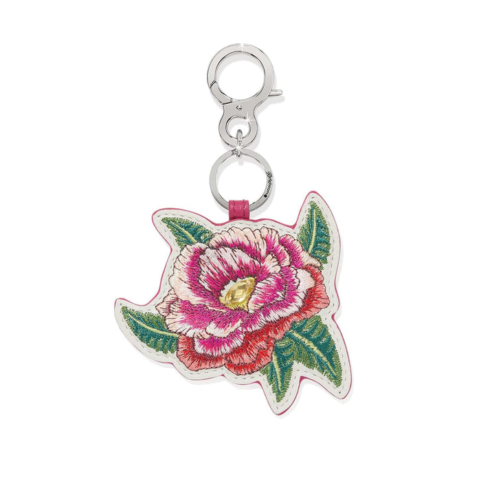 Brighton bag charm with embroidered pink floral leather design, yellow crystal center, and silver-tone clasp on a white background