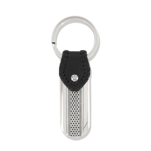 Brighton key fob with black braided leather accent, silver-tone tag, woven texture detail, and split ring on a white background