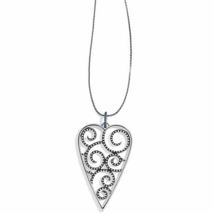 Brighton pendant necklace with silver-plated heart featuring swirl cutouts and blue crystal bail on a white background