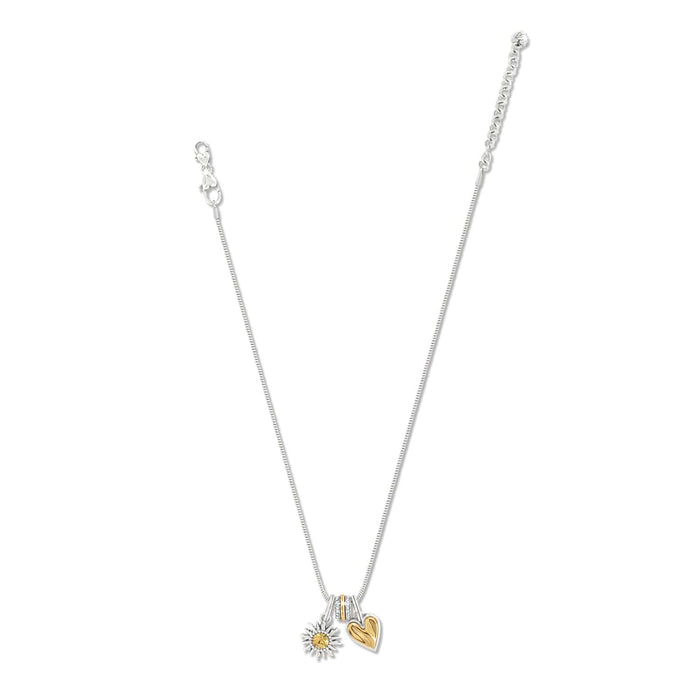 Brighton silver-plated charm necklace with crystal accent, silver sunflower charm, and gold heart charm on a white background