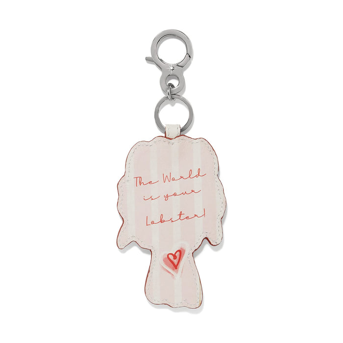 Brighton leather bag charm shown from the back with pink stripes, script text, and heart detail on a white background