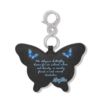 Brighton butterfly bag charm in black leather with blue butterfly print and silver-tone clasp on a white background