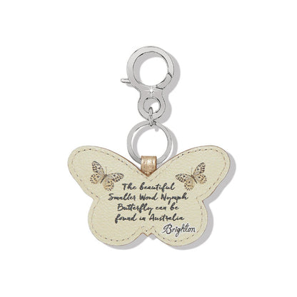 Brighton butterfly bag charm in cream leather with printed butterflies and script text on a white background