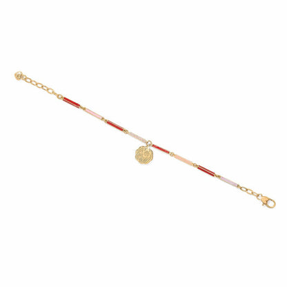 Brighton gold-plated bracelet with red, pink, and white enamel bar links and floral medallion charm on a white background
