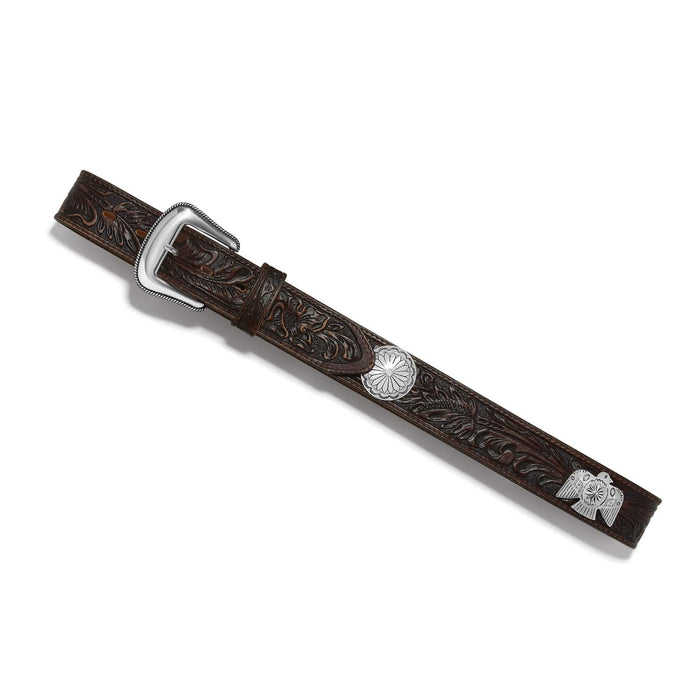 Brighton brown tooled leather belt with silver-tone buckle, concho, and thunderbird accents on a white background