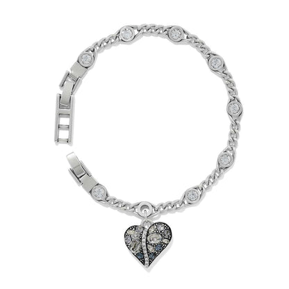 Brighton silver-plated chain bracelet with crystal stations and dangling crystal-encrusted heart charm on a white background