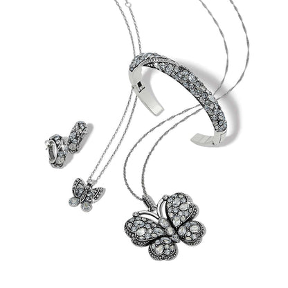 Brighton silver-plated butterfly jewelry set styled with crystal cuff bracelet and matching hoop earrings on white background